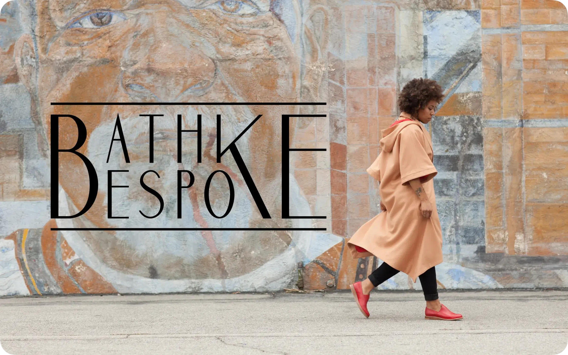 Bathke Bespoke campaign cover: the logotype over a painted mural, model in a camel coat