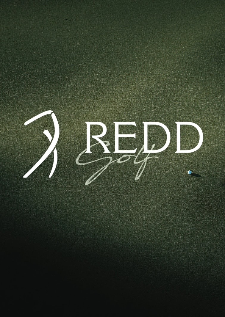 Redd Golf strip card: the symbol and wordmark on course green